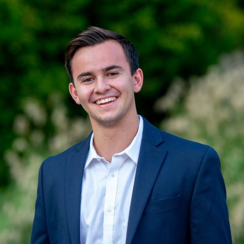 Headshot of Elliot Kelly, senior manager within Strategy Consulting at Capital One