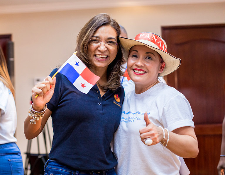Two employees in Panama, smiling widely