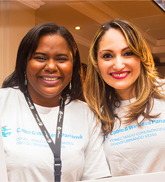 Two smiling tech employees