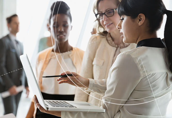 Female IQVIA Clinical Research Associates working at a computer