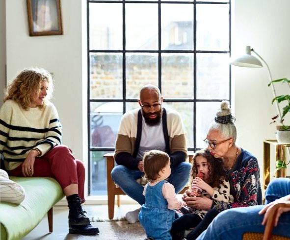 family sitting together in living room