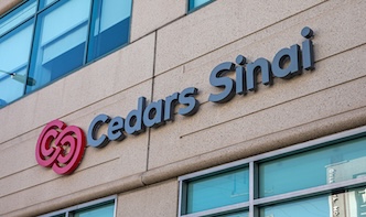 Cedars-Sinai Medical Center building exterior with prominent logo.