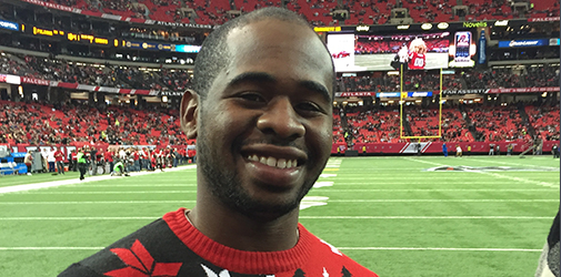 Chima smiles on a football field