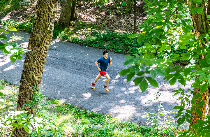 A man running on a paved road