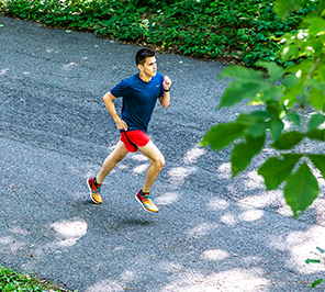 A man running on a paved road