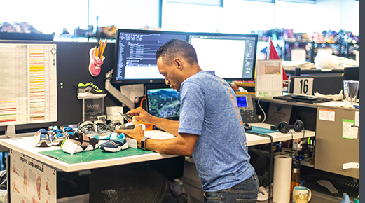 Pedro tinkers with a shoe at his desk