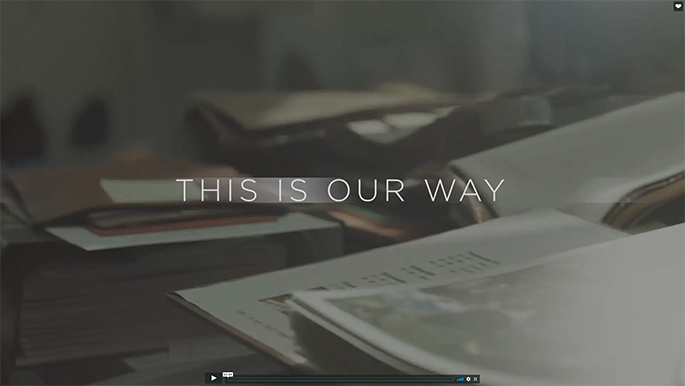 A video screenshot shows the title “This is our way” against a stack of papers