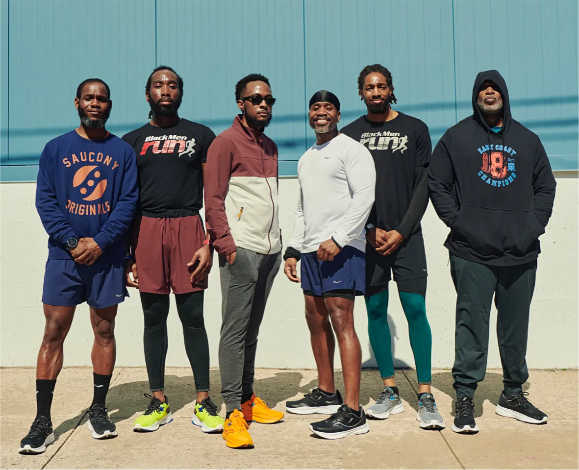 a group of six men posing