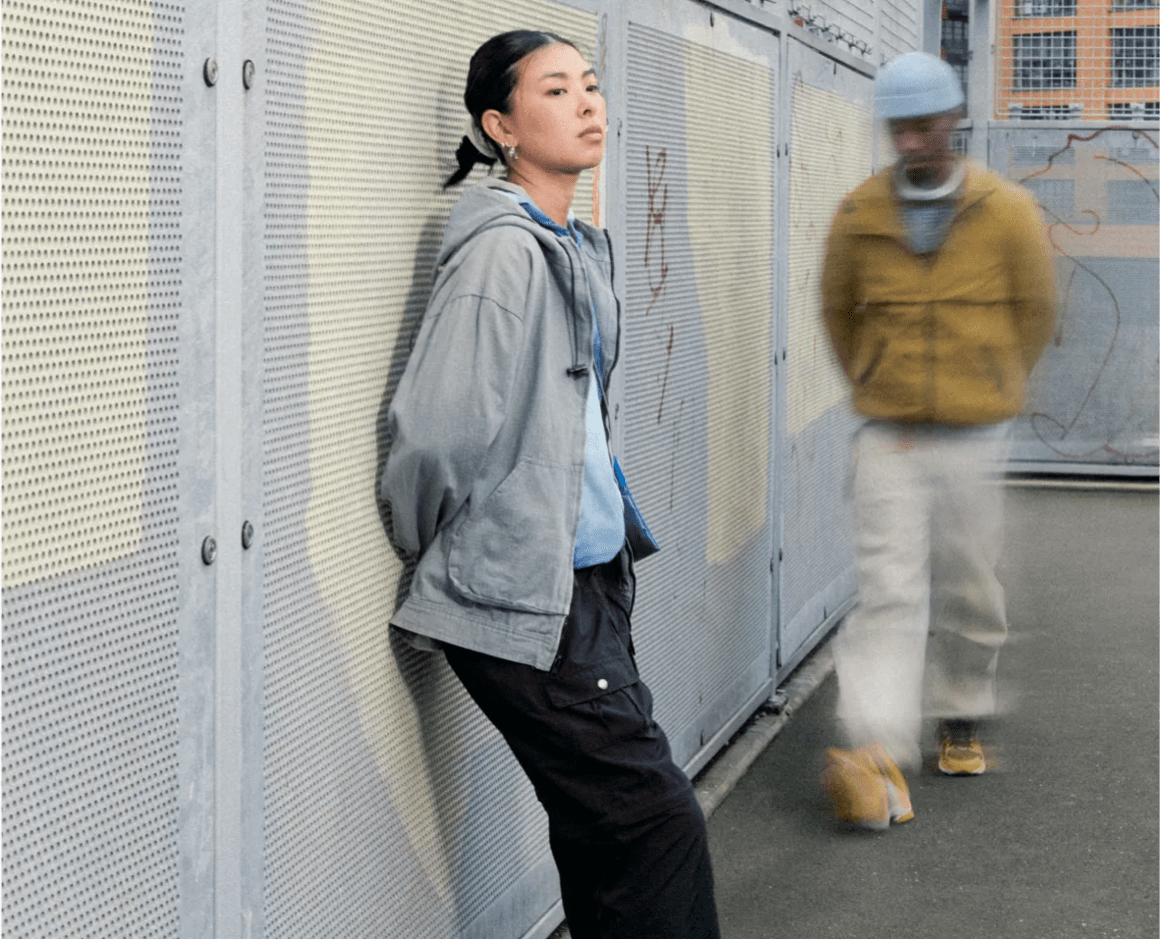 woman resting against wall