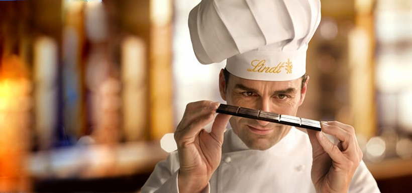  A chef inspecting a finished chocolate bar