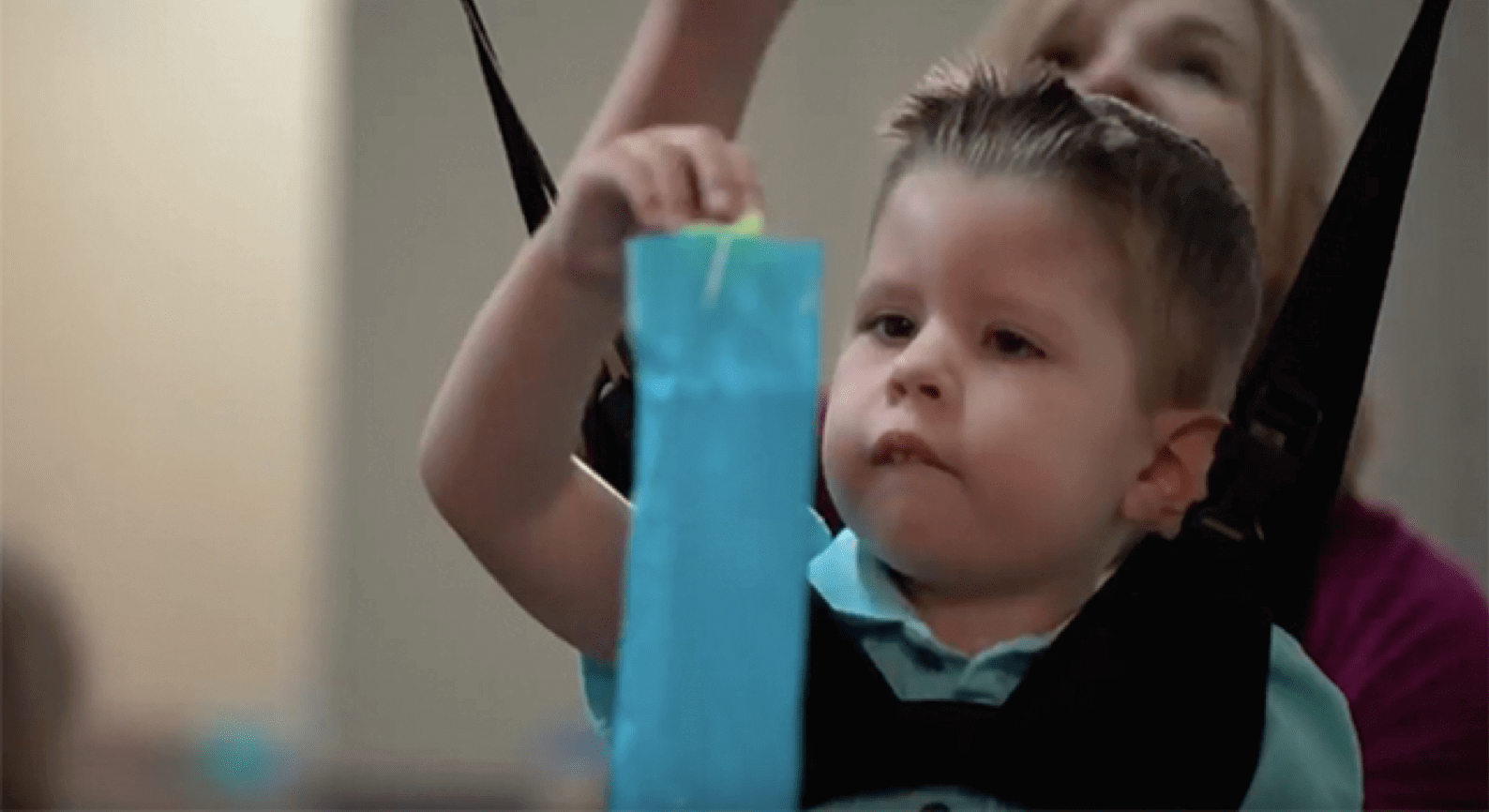 Play Video: A child at the St. Augustine Austin Campus in a gait system harness.