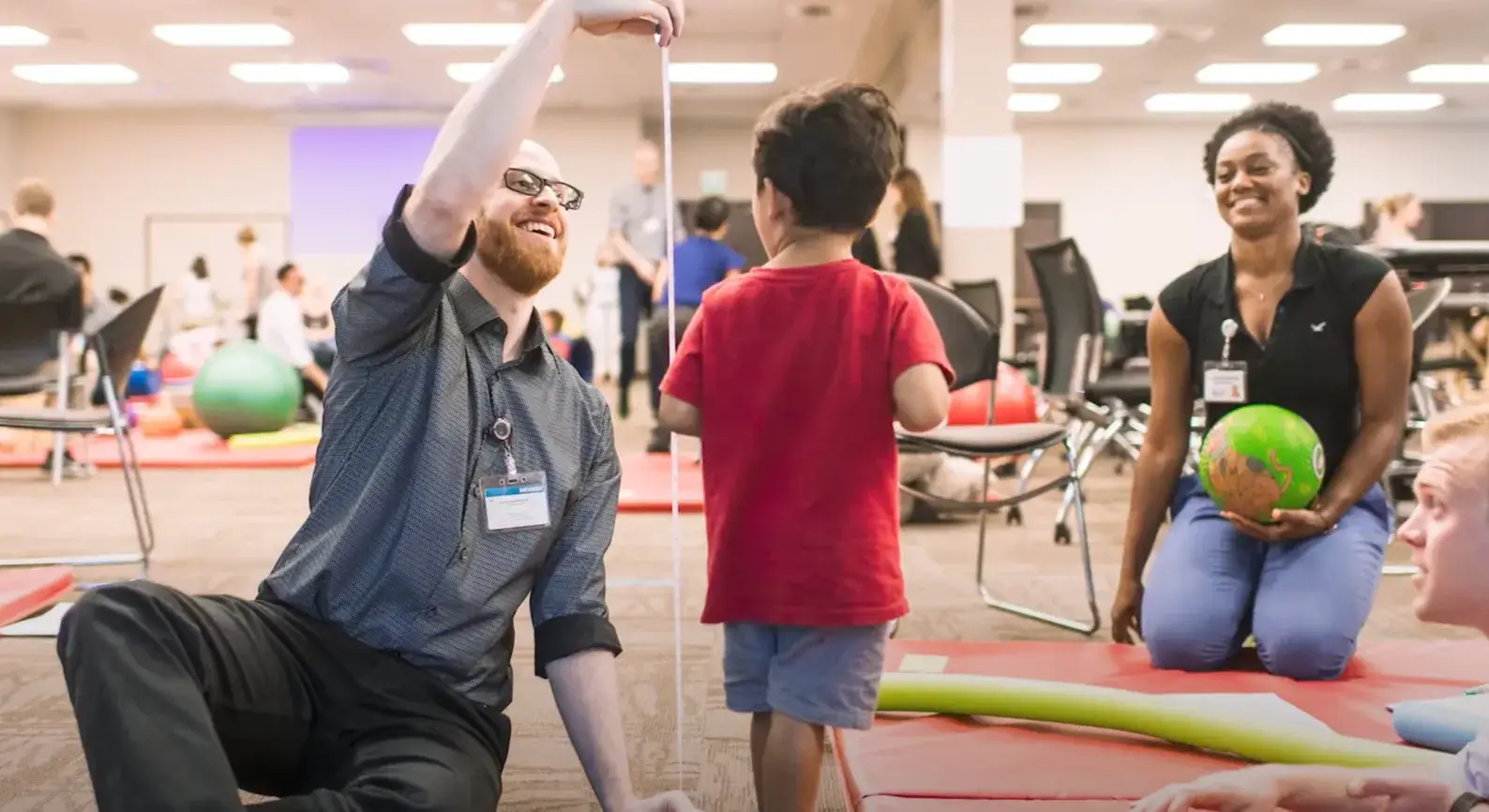Play Video: Children physical therapist measuring a little boys height