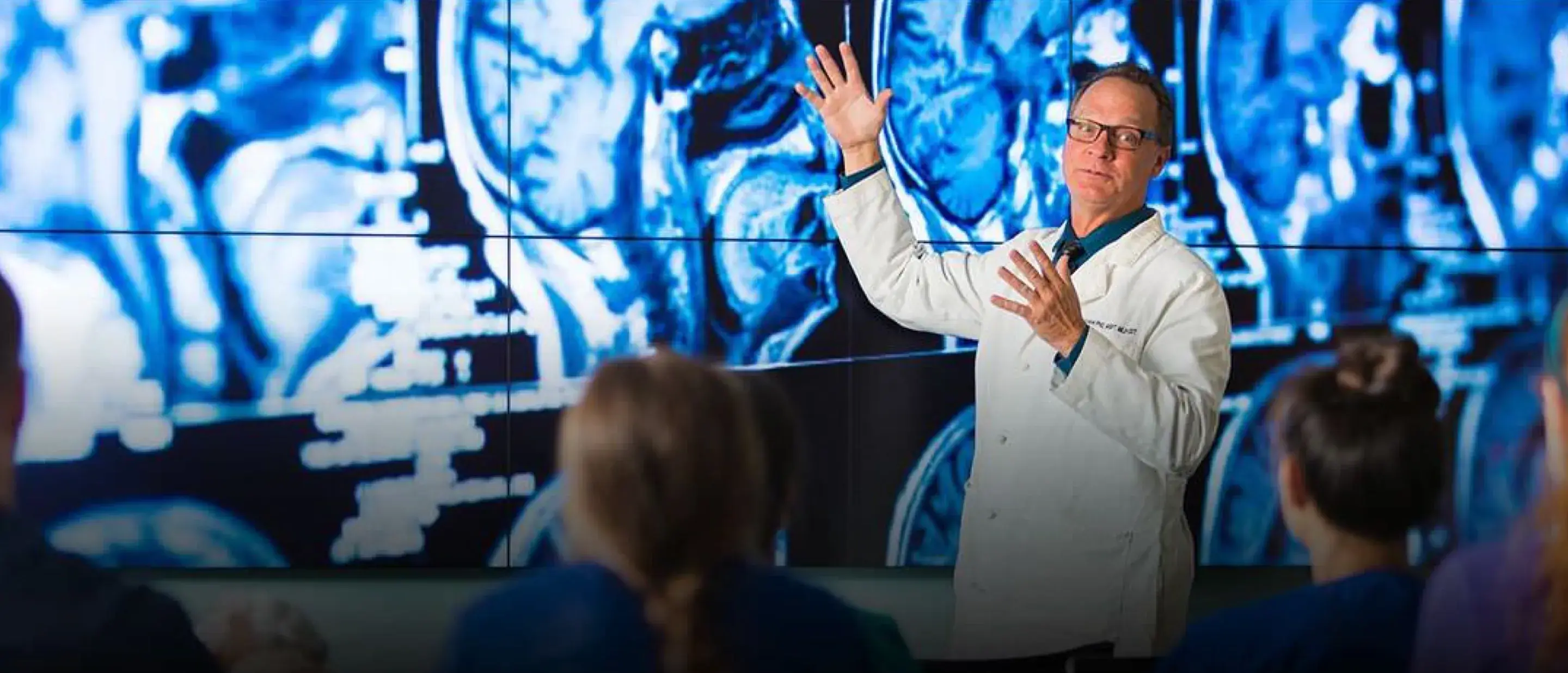 Doctor presenting a presentation to a class