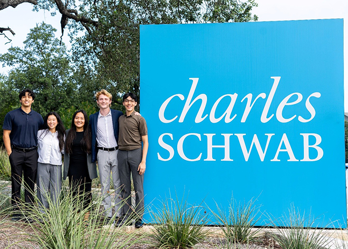 Schwab 2026 Interns Posing with Charles Schwab Logo