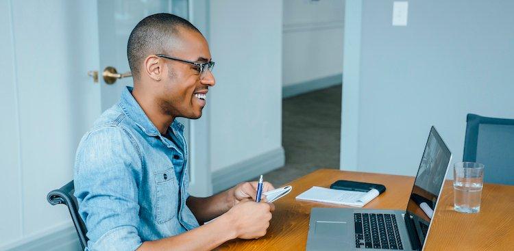 Man using laptop for an inverview from home