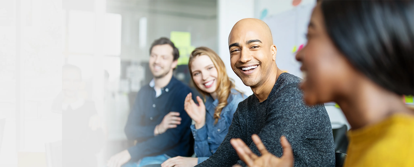 NetApp Professionals laughing in a meeting