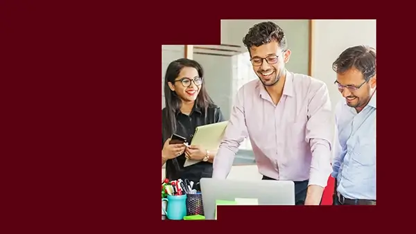 Three employees enjoying their company while at work