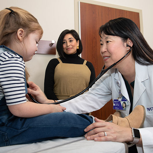 Woman doctor examining patient