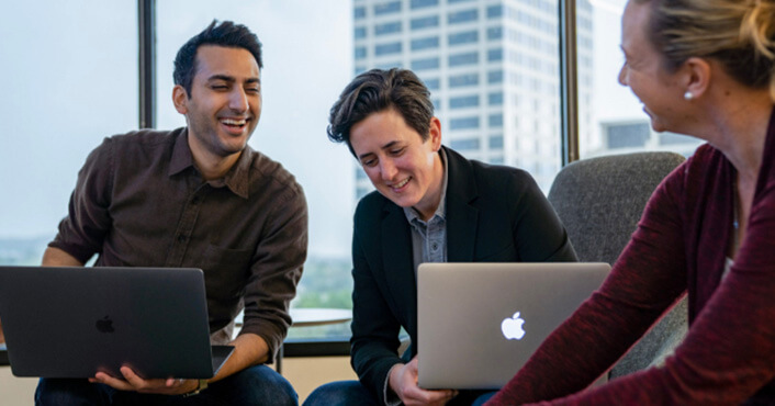 Happy Chipotle employees collaborate in the Newport Beach, California headquarters.