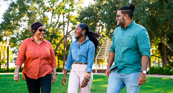 Coworkers having a casual conversation in a park