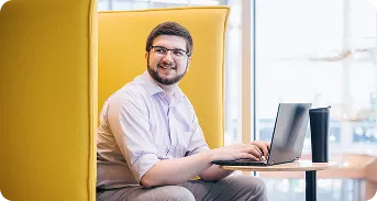 A man reading about job simulation programs on a desktop device