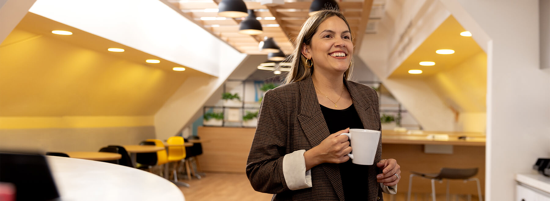 A woman holding a mug