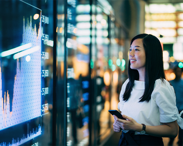 woman staring at computer screens