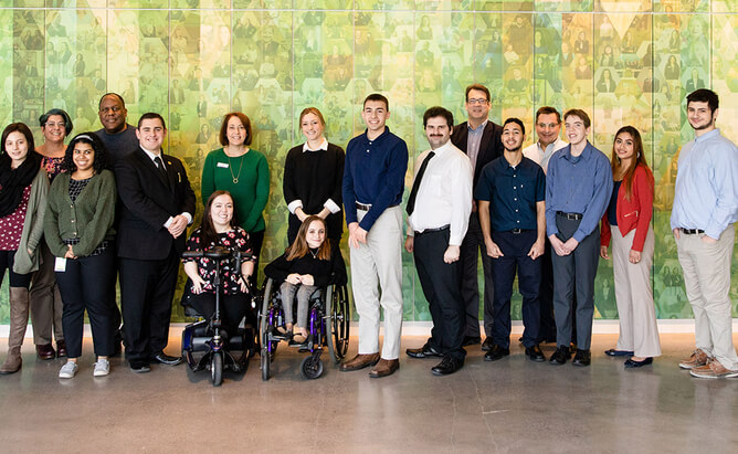 group photo of disabled individuals and event participants