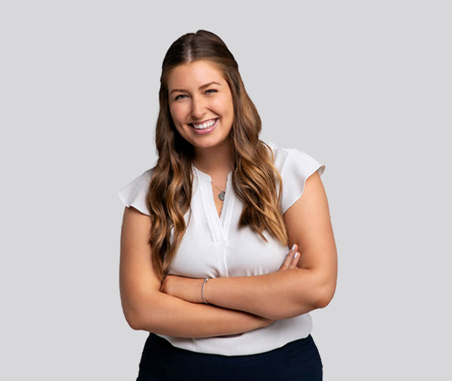 young female employee wearing office attire and smiling