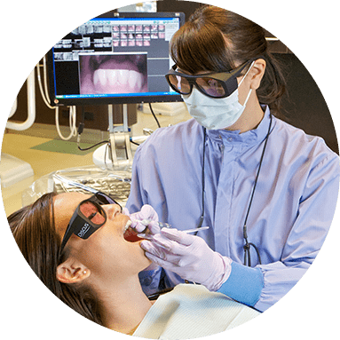 dentist performing dental work on patient