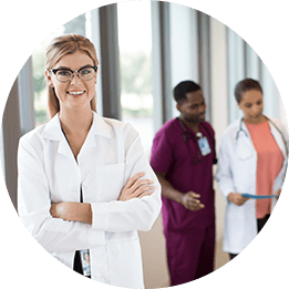 female doctor with patients and nurse in background