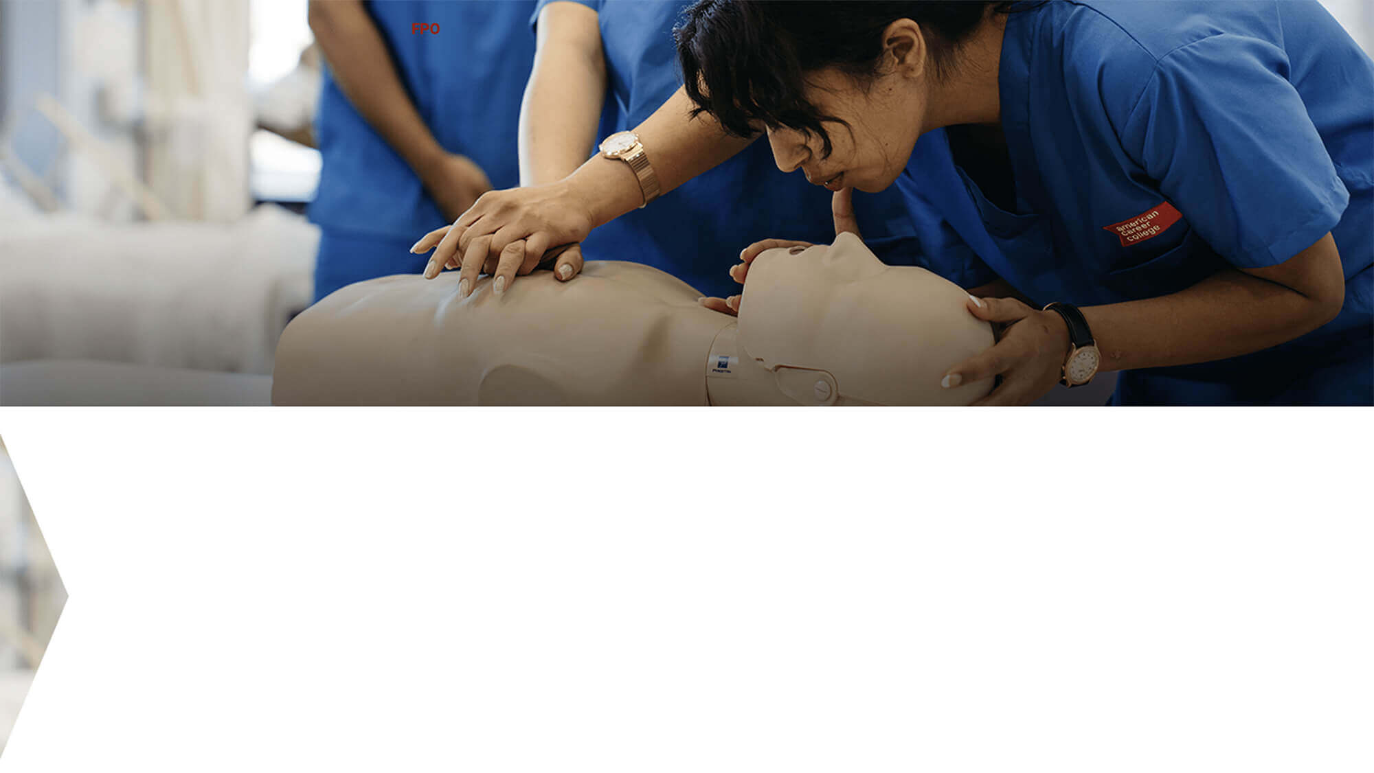 ACC students practicing CPR on a dummy