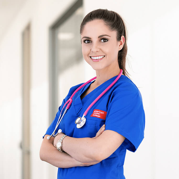 female nurse smiling and crossing her arms