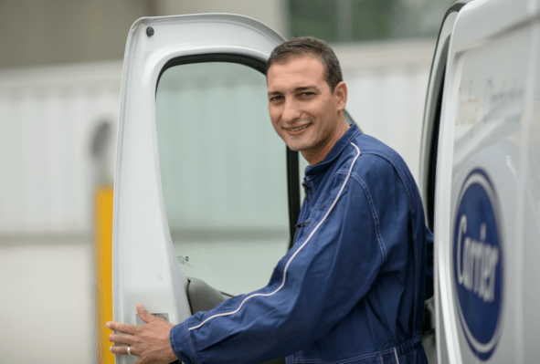 Man sitting in car and smiling