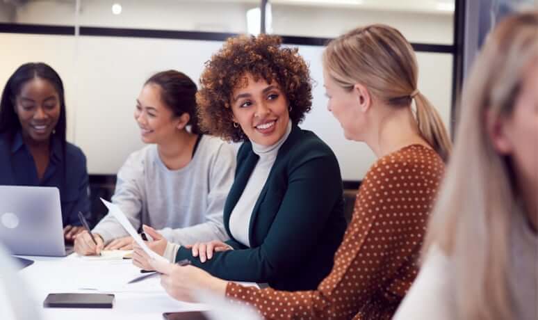 Carrier employees brainstorming together in a conference room