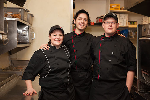 Kitchen Manager and 2 Cooks posing for a picture