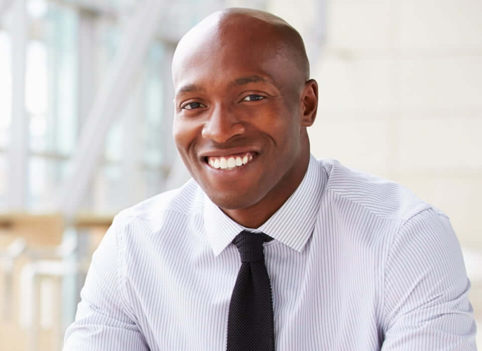 African-American male employee smiling