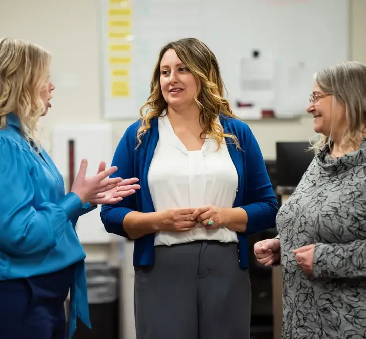 Three people talking