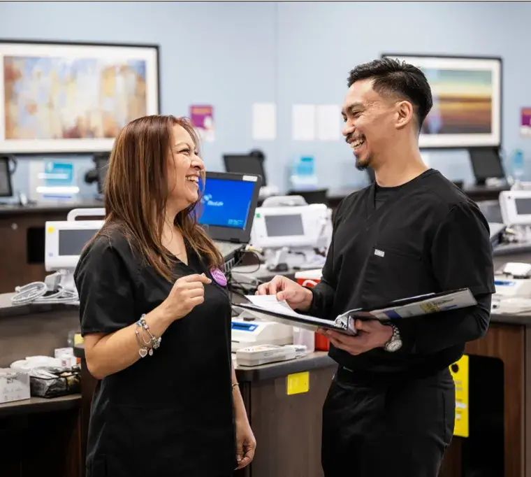 Man and woman talking to each other by a desk