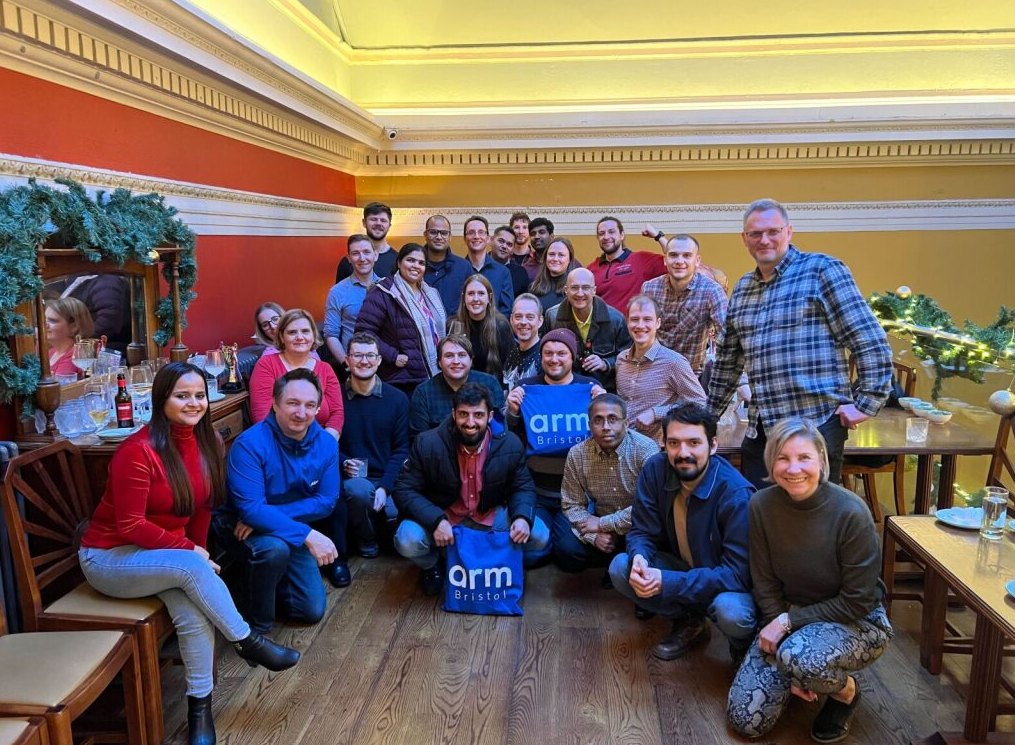 Group photo of a team gathering in a festive setting