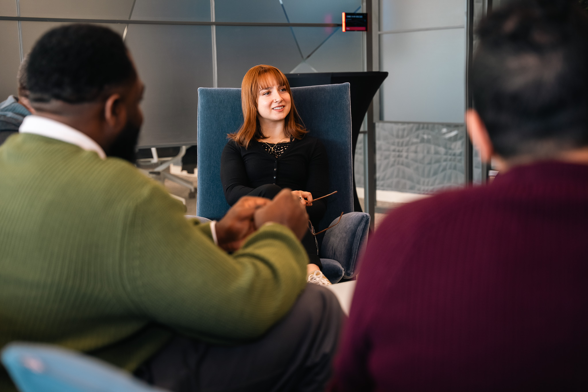 Team members having a discussion in a modern office