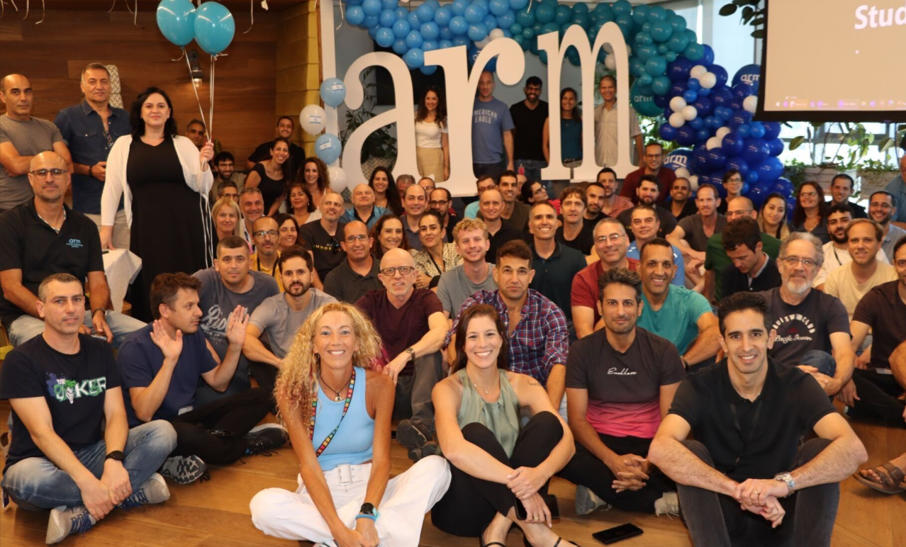 Team celebration with Arm balloon backdrop