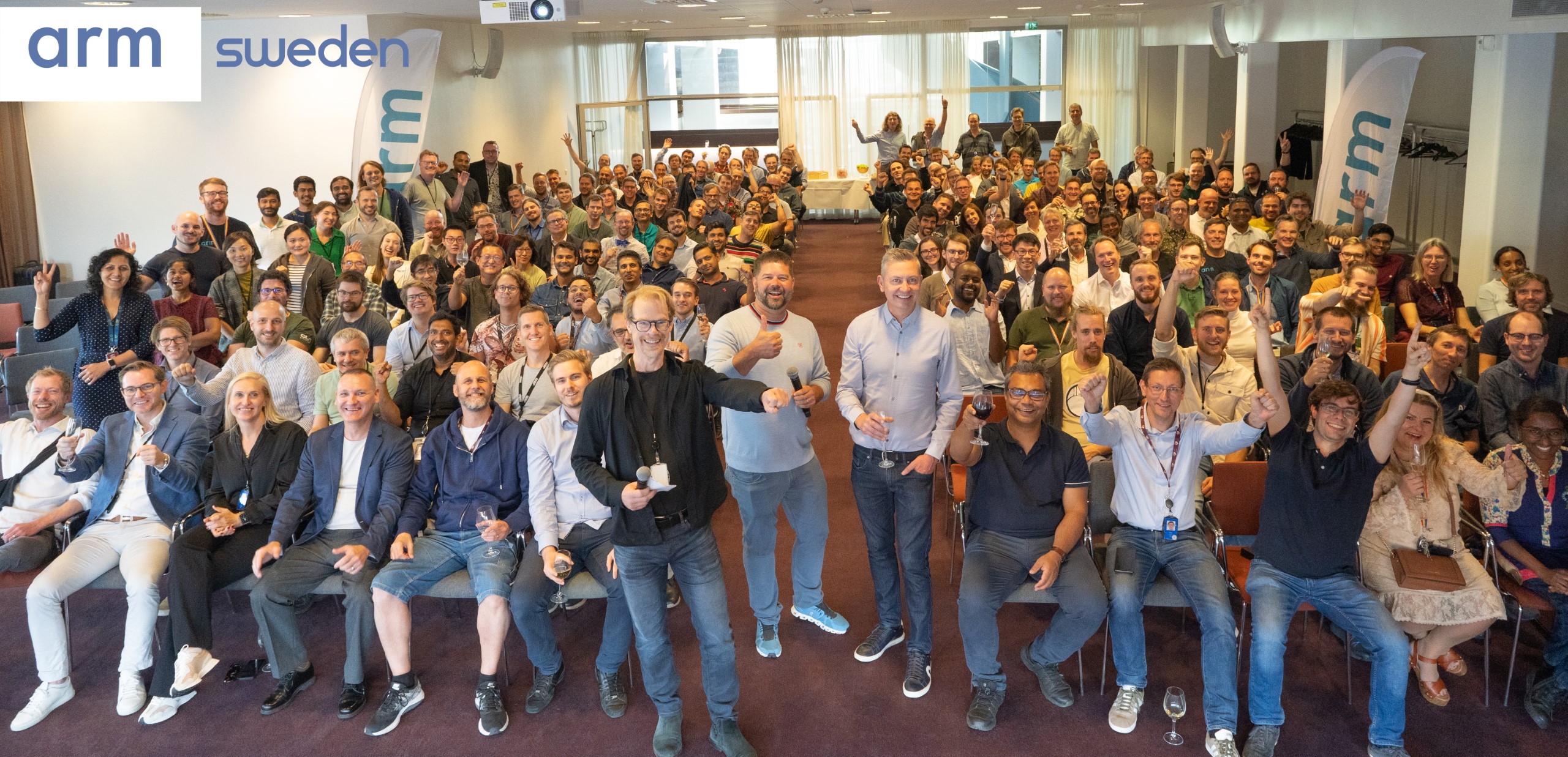 Large group of people celebrating at ARM Sweden.