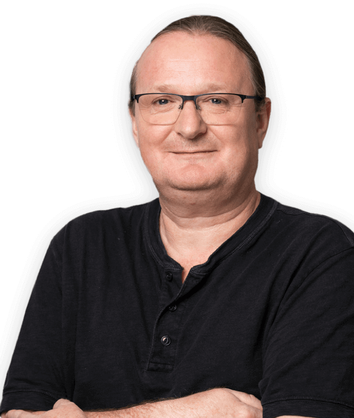 Smiling man in black shirt with glasses.