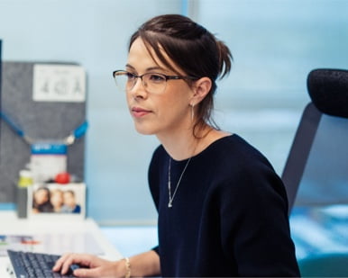 woman sitting at her desk
