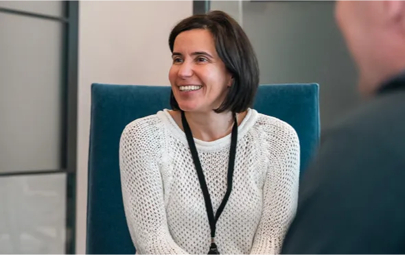 Smiling woman in a white sweater