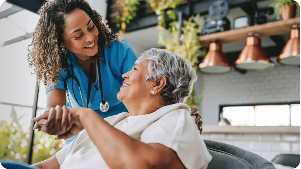female medical professional greeting a feamale patient