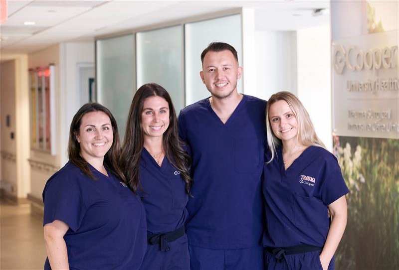 Three registered nurses interlocked and posing for a picture