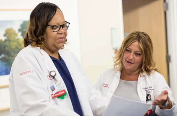 Two doctors looking at a document