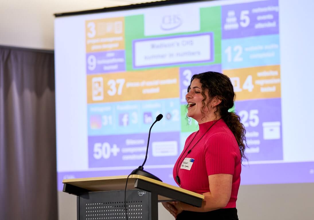 Women speaking at a podium